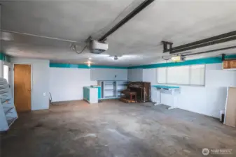 Room for hobbies in the big garage with half bath.