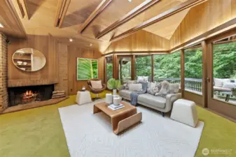 Gather by the fire in this timeless Mid-Century living room, where brick, wood, and nature-inspired design come together beautifully.