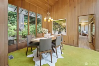Gather in style—Elegant dining room with vaulted ceilings and warm finishes, designed for both intimate meals and lively gatherings.