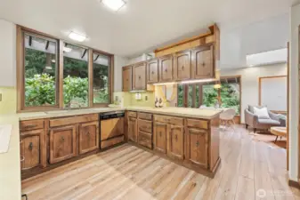 Generous counter space and rich finishes are enhanced by an open layout that flows seamlessly into the family room, creating a warm and light-filled gathering space.