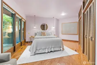 The expansive Primary Suite offers seamless indoor-outdoor living with private patio access, perfect for quiet mornings or evening relaxation.