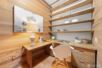 Tucked away within the Primary Suite, a versatile den/office offers the perfect space for a home office, reading corner, or creative retreat.