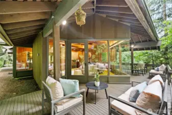 An expansive upper-level deck wraps around the living room, creating seamless indoor-outdoor flow for entertaining and relaxation. Side access connects directly to the family room deck, uniting the home’s outdoor living spaces into one cohesive retreat.