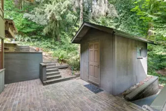 Charming outdoor shed featuring built-in shelving—perfect for organized storage, gardening essentials, or inspiring creative projects.
