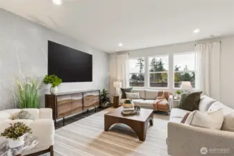 Enjoy hosting with ample great room with large windows for natural light. Photo is representational. Actual home is under construction. Colors, materials, and features may vary. See site agent for details.