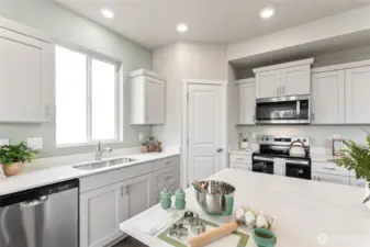 Bright, modern, kitchen, with large pantry and deep butcher style stainless steel sink. Photo is representational. Actual home is under construction. Colors, materials, and features may vary. See site agent for details.