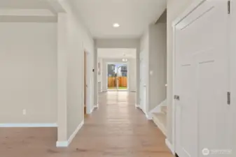 Hardwood flooring included in entry, kitchen, dining and nook area adding warmth and continuity throughout the hallway.