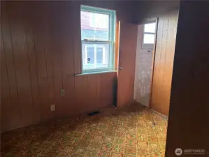 downstairs bonus room with stairs to upstairs