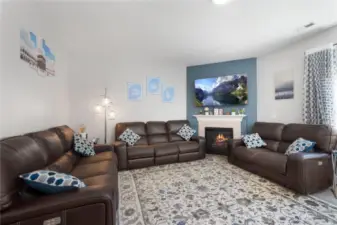 3 couch size family room with gas fireplace