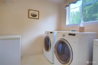 Laundry room with laundry tub and room for a freezer.