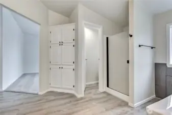 Lots of storage.  Door between the shower & cabinets is the toilet.