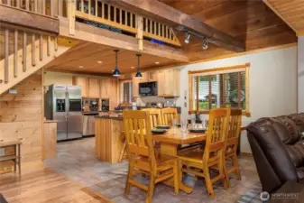 Elegant Dining Space for Six    Enjoy meals around a solid wood dining table with comfortable seating for six. Tiled floors offer easy maintenance while complementing the room's inviting style.