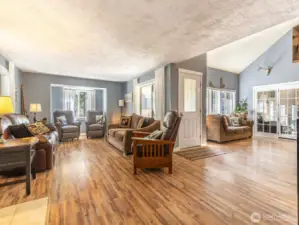 Warm and welcoming, the spacious main living area features vaulted ceilings, abundant natural light, and durable wood-style flooring—perfect for relaxing after a day of mountain adventures.