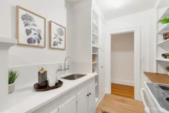Just installed quartz counters with undermount sink and new faucet + refinished butcher block + fresh paint + new blinds!