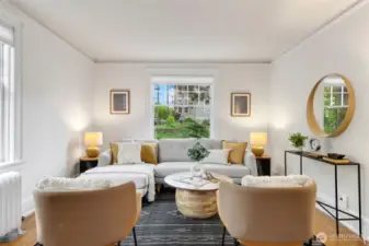 Gracious and spacious living room that glows with natural light from 2 sides in