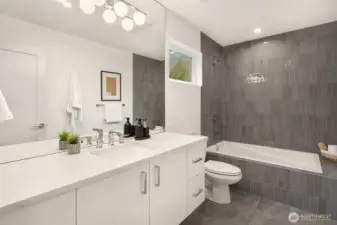Guest Bathroom with Drop-in Tub, Tile Surround and Floating Vanity