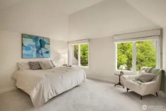 Upstairs enjoy a spacious primary suite with vaulted ceilings and gorgeous windows letting nature in!