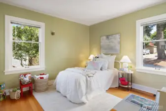 The north bedroom on the main floor is inviting with refinished Fir Floors.