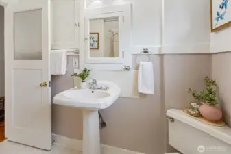 The classic details and cute door make this bathroom darling.
