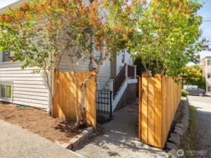 This gate opens to your patio and access to the home on the north side.