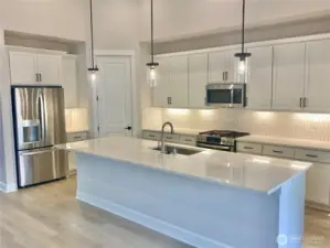 Refrigerator and gas range included.
