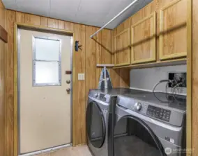 Large Utility Room with outdoor access to newer back deck