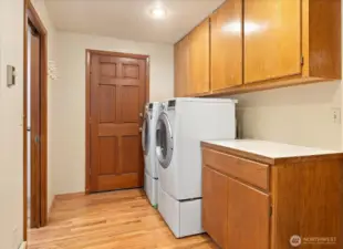 Your mudroom offers dual access! Come in from outside after a day of gardening or from working in your garage or step inside after  parking your vehicle in your attached 2 car garage. Either way, the mess stops here with the convenience of your laundry room to toss all your work wear into.