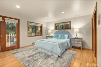 French doors lead into your primary suite which features 2 closets including a walk-in closet, a 5 piece ensuite & access to your deck to enjoy morning coffees or late night wine downs.