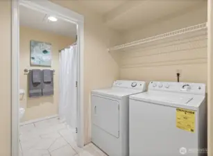 Your MIL has its own laundry room complete with lots of storage.