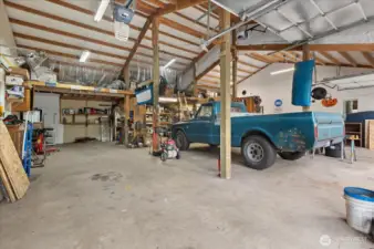 Detached garage with remarkable capacity, perfect for automotive enthusiasts or serious hobbyists. There's plenty of room for all your vehicles, toys, work trucks & more!