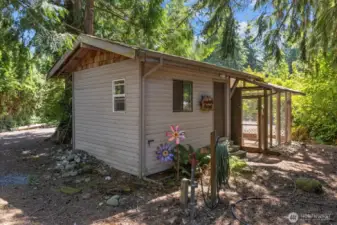 Calling all hobbyists! This property offers a sanctuary complete with outbuildings to  fulfill your creative pursuits. This workshop space with power & quick connect water is just waiting for your touch! Endless  possibilities to use this space as a workshop, artist/recording studio, home office or a gym.