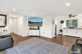 The spacious living room is bright and cheerful.