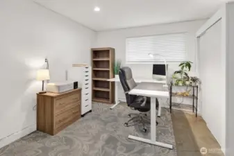 The bonus room is large and is also being used as an office