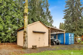 The property also features a storage shed and covered carport
