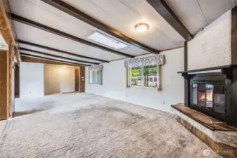 Gather around the cozy fireplace in the living room.