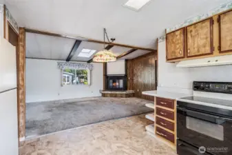 The chef can stay connected and visit with guests gathered in the living room.