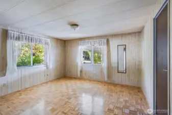 The primary bedroom has two light-filled windows.