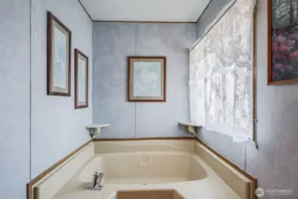 Relax in this primary suite soaking tub.