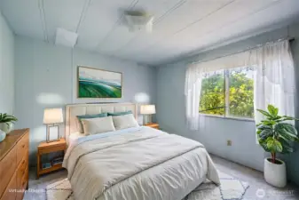 At the opposite end of the home is the second bedroom- shown here vitually staged.