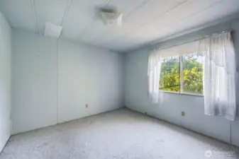 The second bedroom shown without staging.