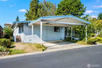 Great carport provides easy two-car parking with this wide garage!  No tandem parking needed!!