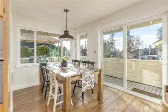 Roomy breakfast nook has slider to the upper deck, perfect for grilling!