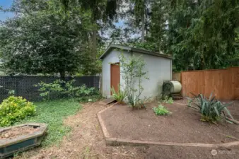 Tool Shed and flower beds.