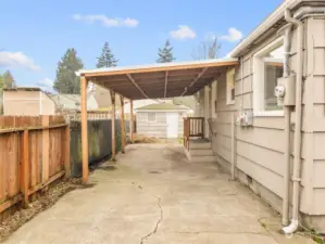 Less than a year old car port, with man door entry into the laundry room.