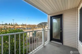 Back door on the covered deck with easy access to 25th Ave SW.