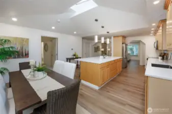 Amazing kitchen is a chef's delight with new quart countertops, newer stainless steel appliances, tons of storage, skylight, designer lighting and generous dining space.