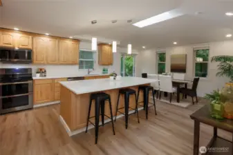 Amazing kitchen is a chef's delight with new quart countertops, newer stainless steel appliances, tons of storage, skylight, designer lighting and generous dining space.