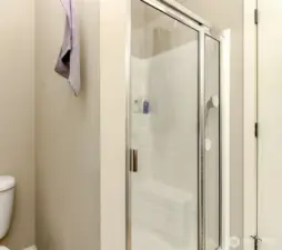 Step-in shower in the primary bathroom.