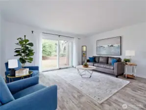 Spacious living room with newer laminate flooring