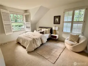 Bedroom #2 is light filled looking over private backyard.